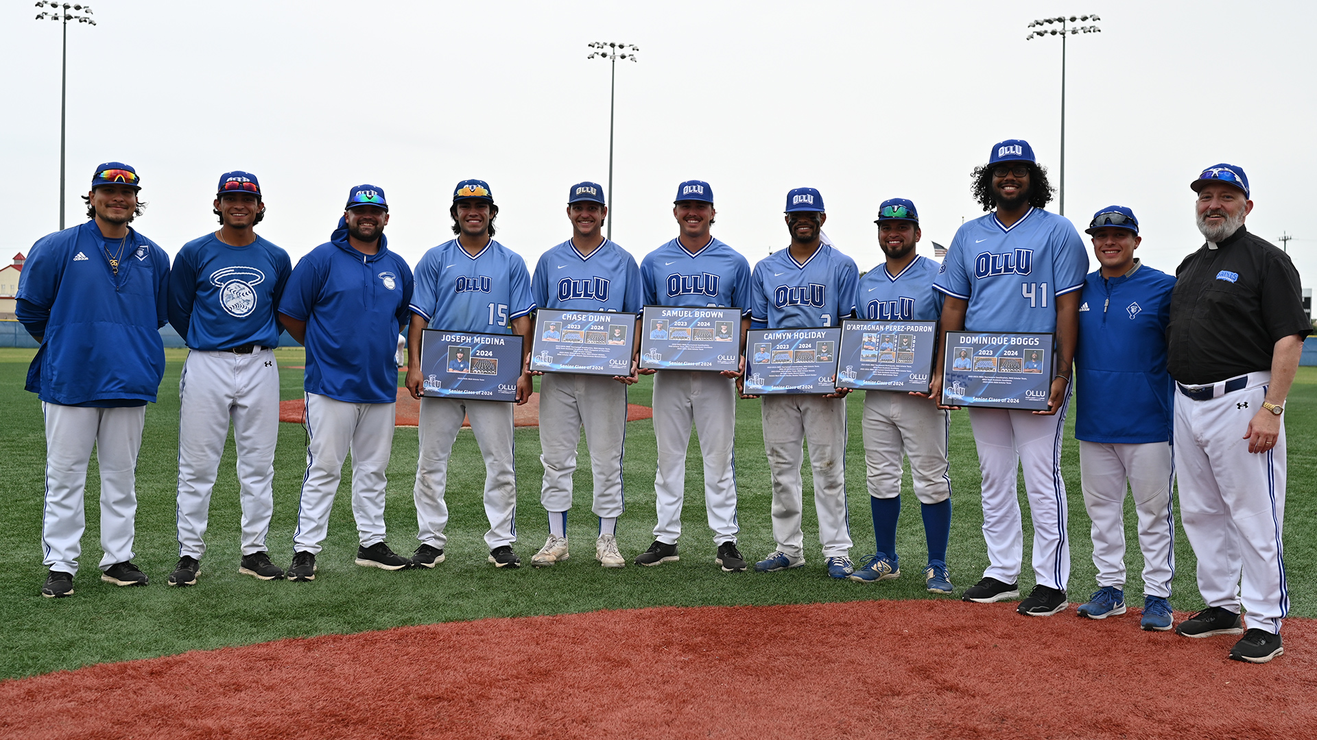 The Saints honored the senior class after the games. Pictured (l-r) are Joseph Medina, Chase Dunn, Samuel Brown, Caimyn Holiday, D'Artagnan Perez-Padron and Dominique Boggs.