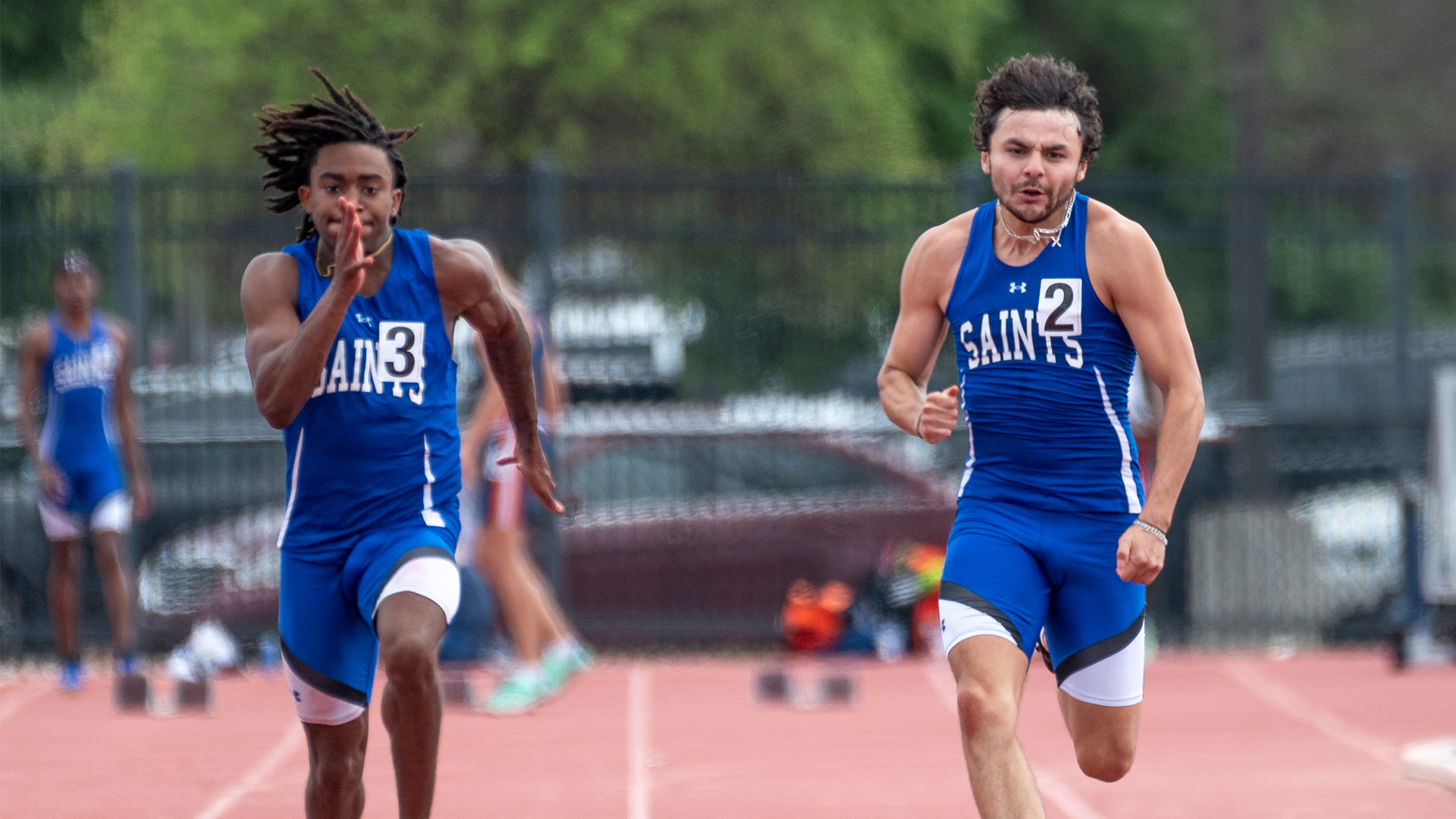 Jimmie Salas (right) placed fourth in the 100m.